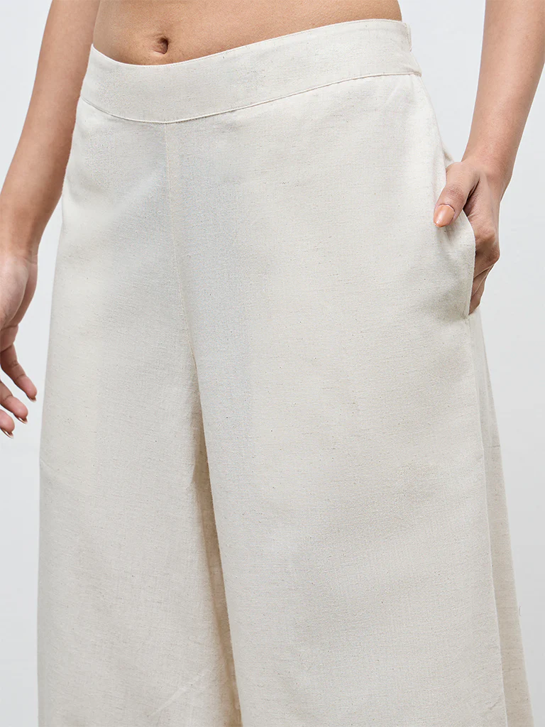 Utsa Off-White Solid Cotton-Blend Palazzos - Image 3