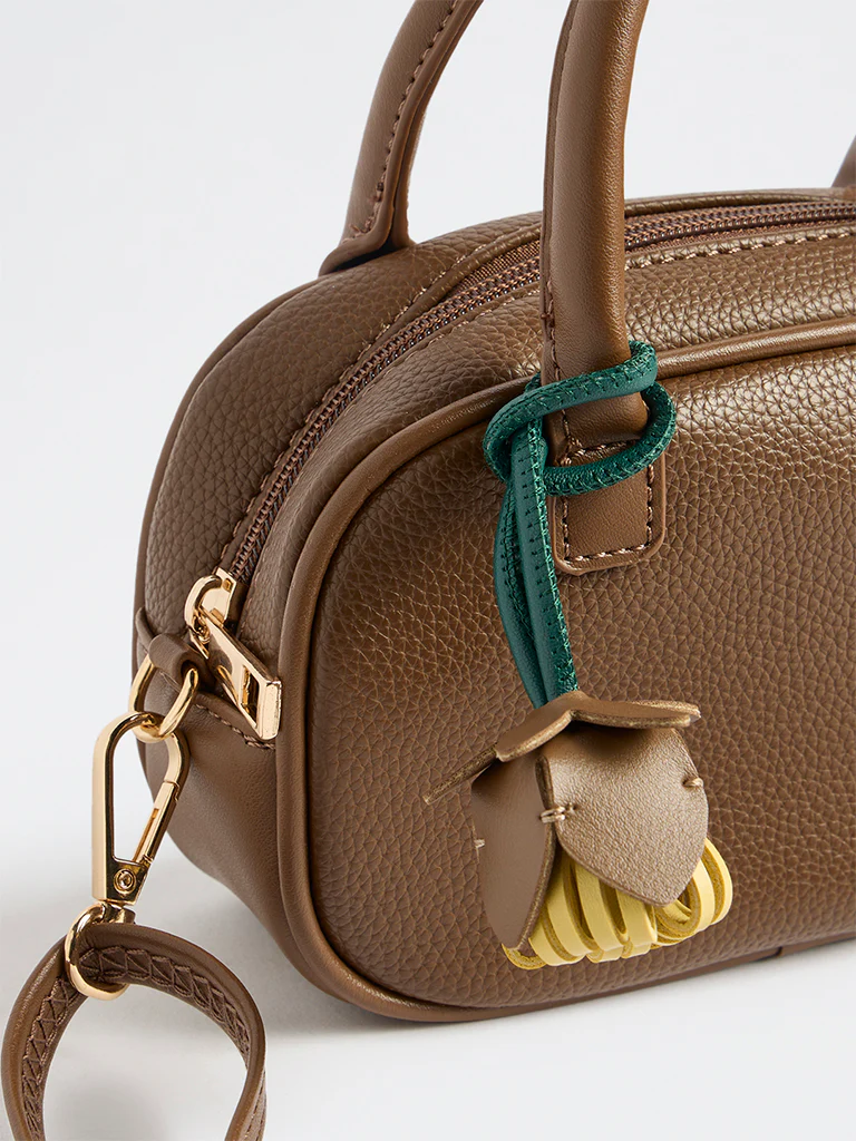 Westside Dark Brown Textured Sling Bag with a Floral Bag Charm - Image 3